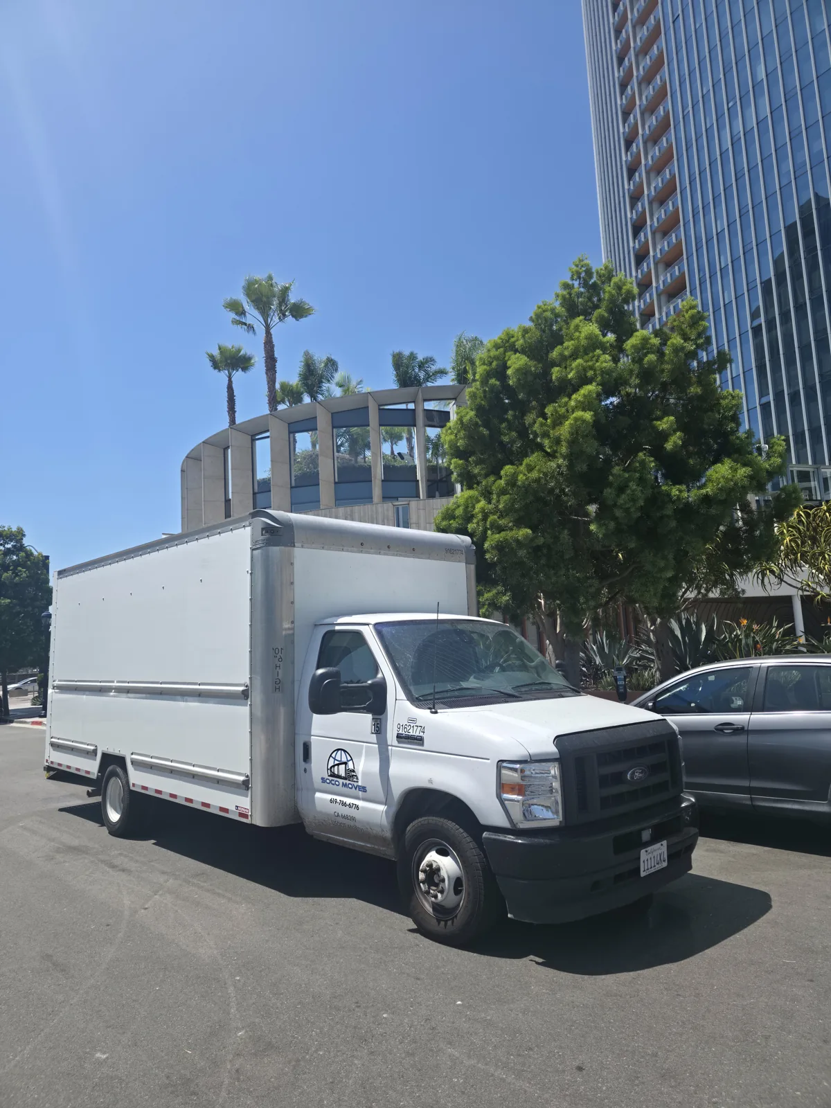 Soco Moves moving truck in front of Pacific Gate in downtown San Diego.